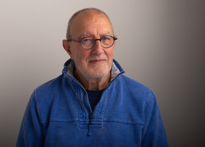 Old Man Old man slightly smiling with grey background